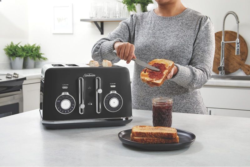TA2840K-sunbeam-toaster-4-slice-black-with-model-in-use